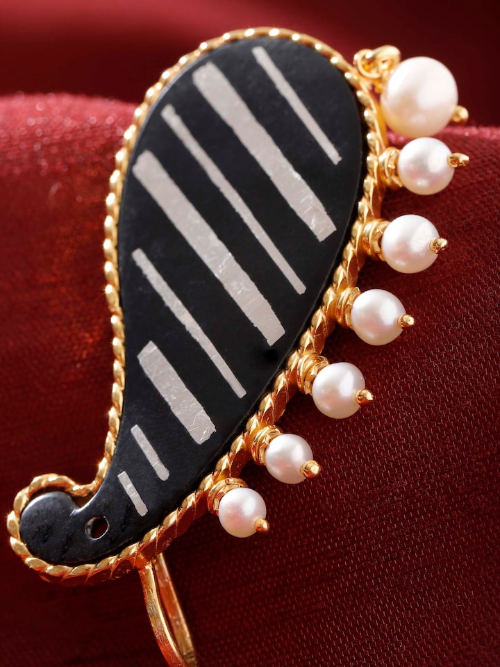 detail view of bidri silver ear cuffs pattern