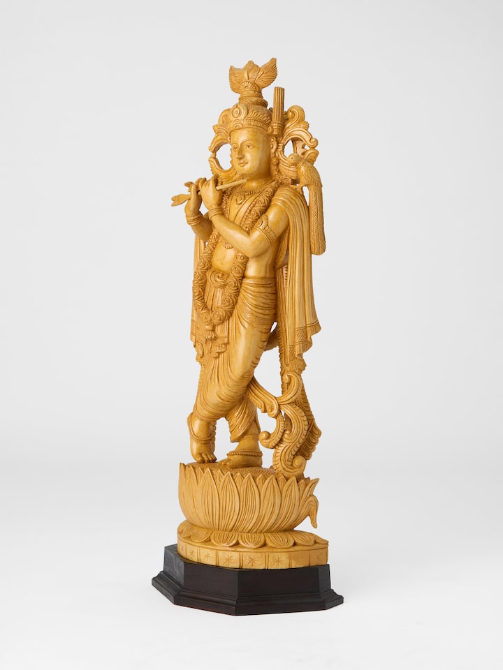 Angled view of the Wood Carved Gopala Idol