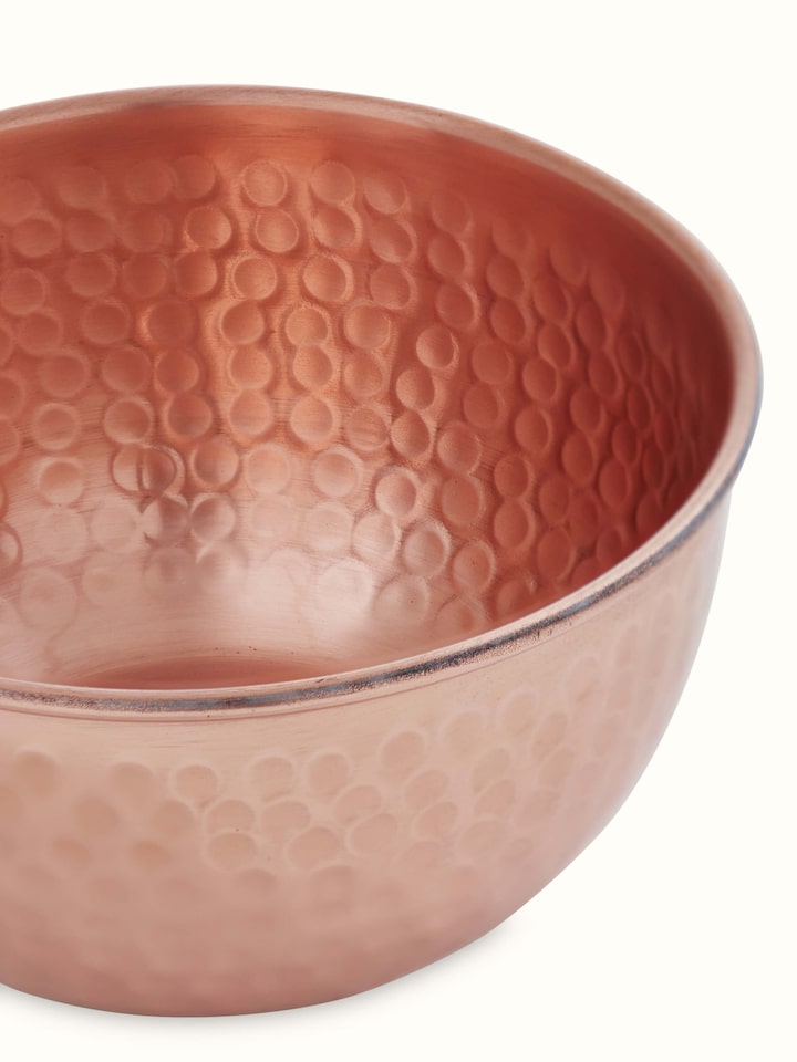 Close-up view of Copper Fruit Bowl highlighting its smooth surface and beautiful shine.
