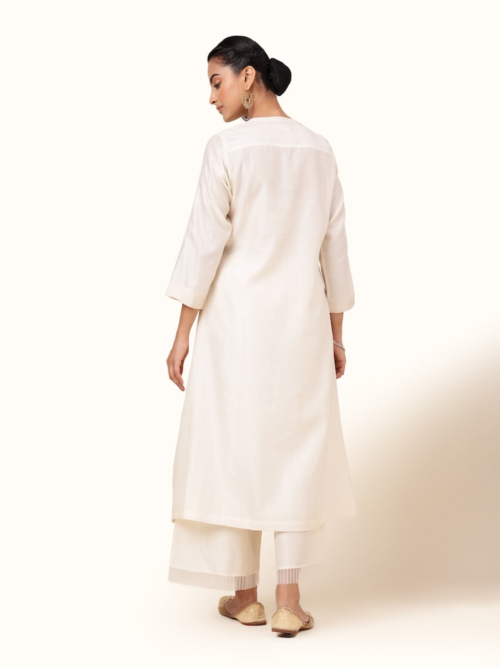 Back view of off-white cotton silk kurta showing clean tailoring and subtle sheen.