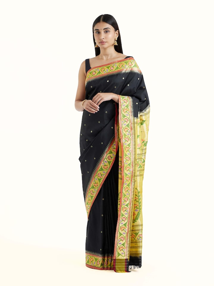 Front view of black silk Paithani saree with rich zari woven motifs