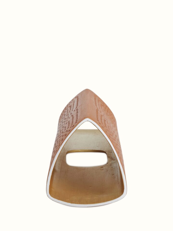 Close-up view of terracotta wall light focusing on the intricate patterns and high-quality terracotta finish