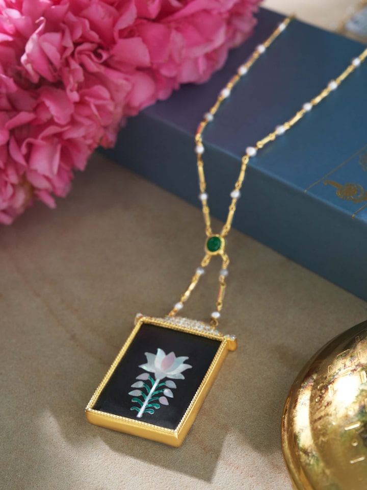 Overhead shot emphasizing pendant design and chain link style