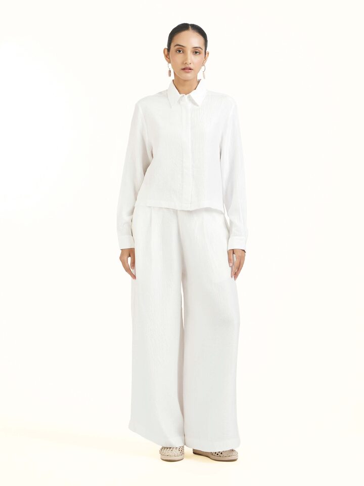 Front view of ivory quilted silk shirt with refined texture