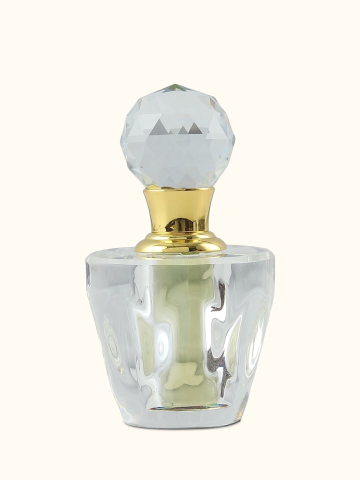 Front view of Attar Oudh Kashmiri bottle showcasing its rich golden hue and elegant glass packaging