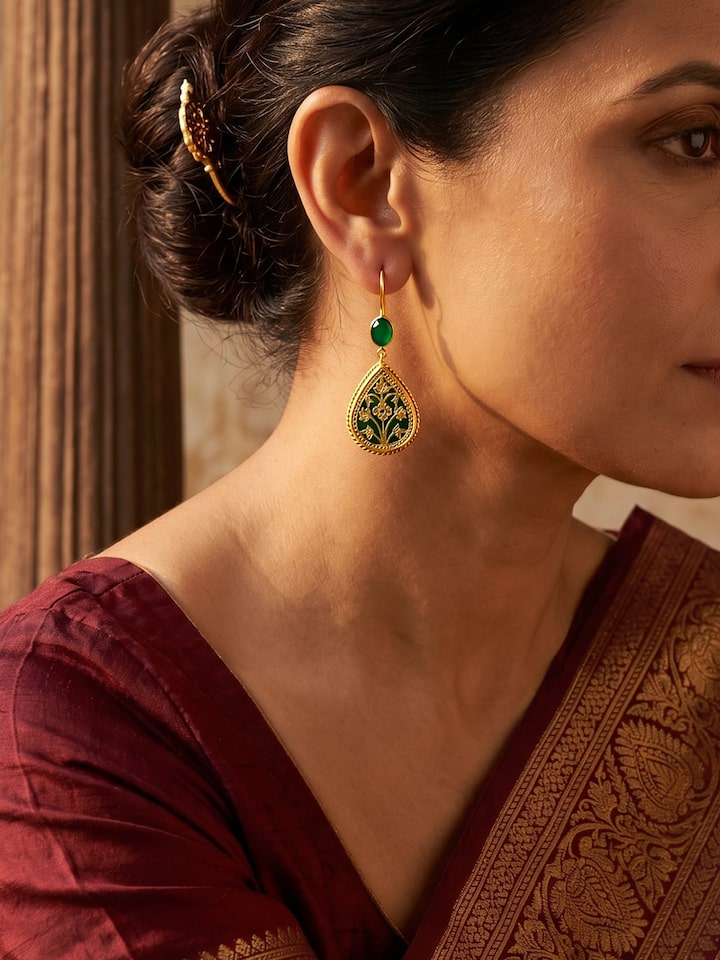 Styled view of Thewa Silver Drop Earrings worn on the ear, showing how it looks styled