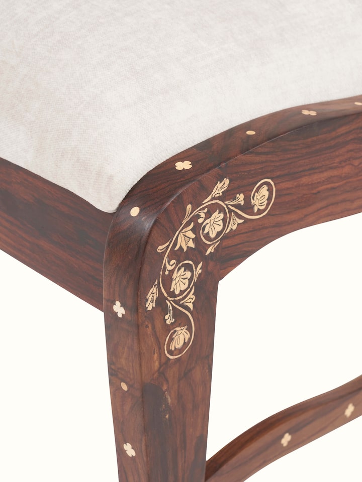 close-up view of upholstered rosewood inlay dining chair detailing