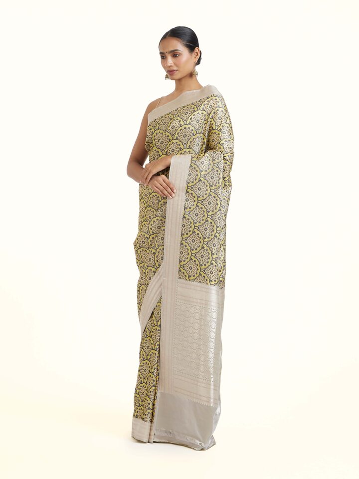 side view of yellow banarasi brocade saree drape