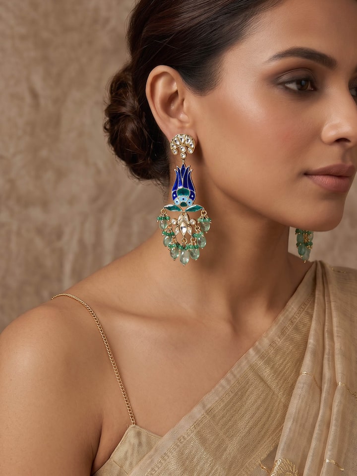 Styled view of Silver Smithing Drop Earrings worn on the ear, showing how it looks styled, from a different angle