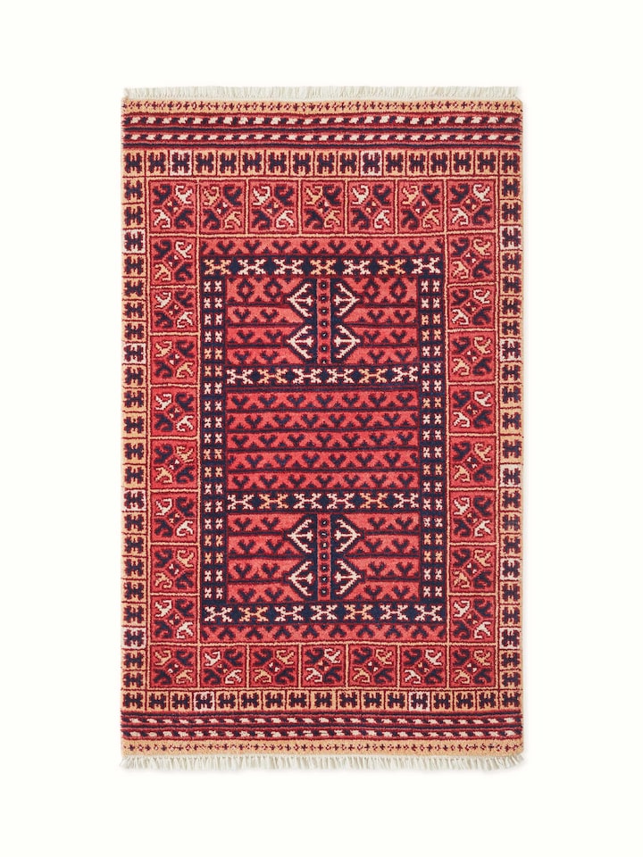 Front view showcasing the vibrant red tribal Kazak design with intricate Agra wool hand-knotting