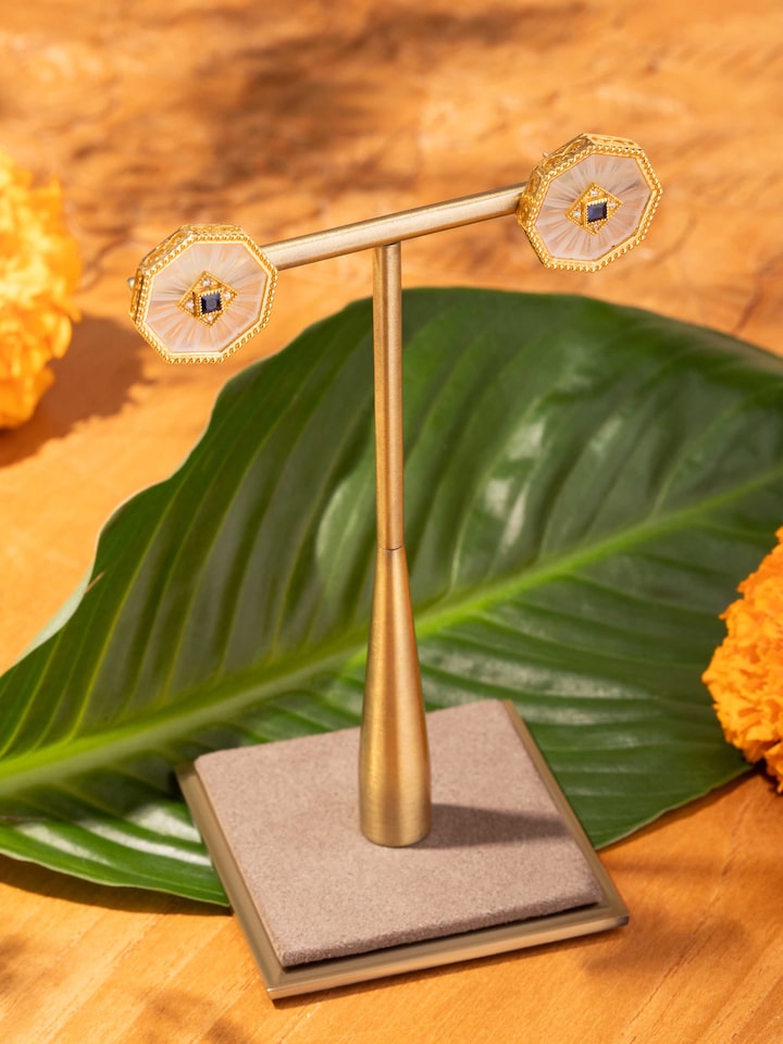 Styled detail view of Lapidary 14 Karat Gold Studs displayed, shown in an alternate styled shot