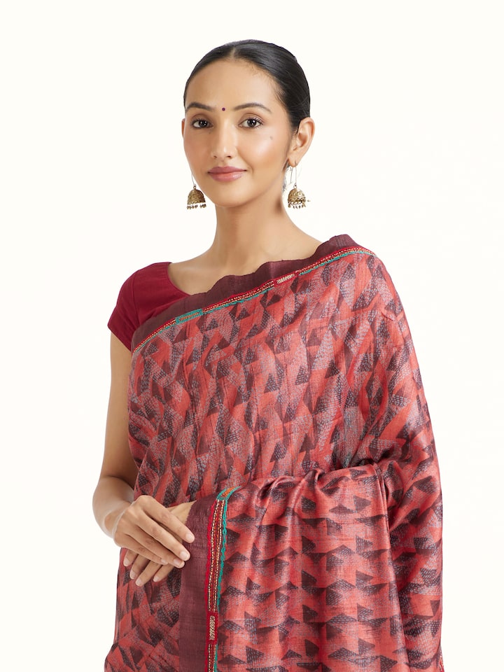 Angled view of the Red Tussar Silk Discharge Printed Kantha Embroidered Saree