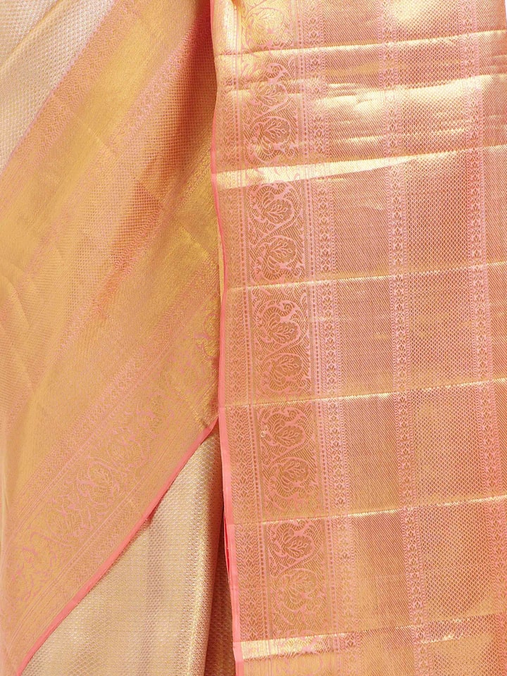 Detail view of beige silk Kancheepuram saree showing silk texture and zari work