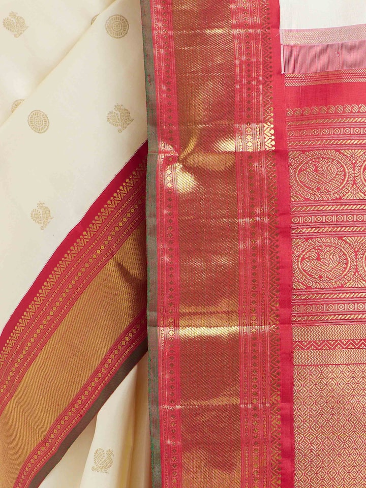 Detail view of off-white silk Kancheepuram saree showing silk texture and zari craftsmanship