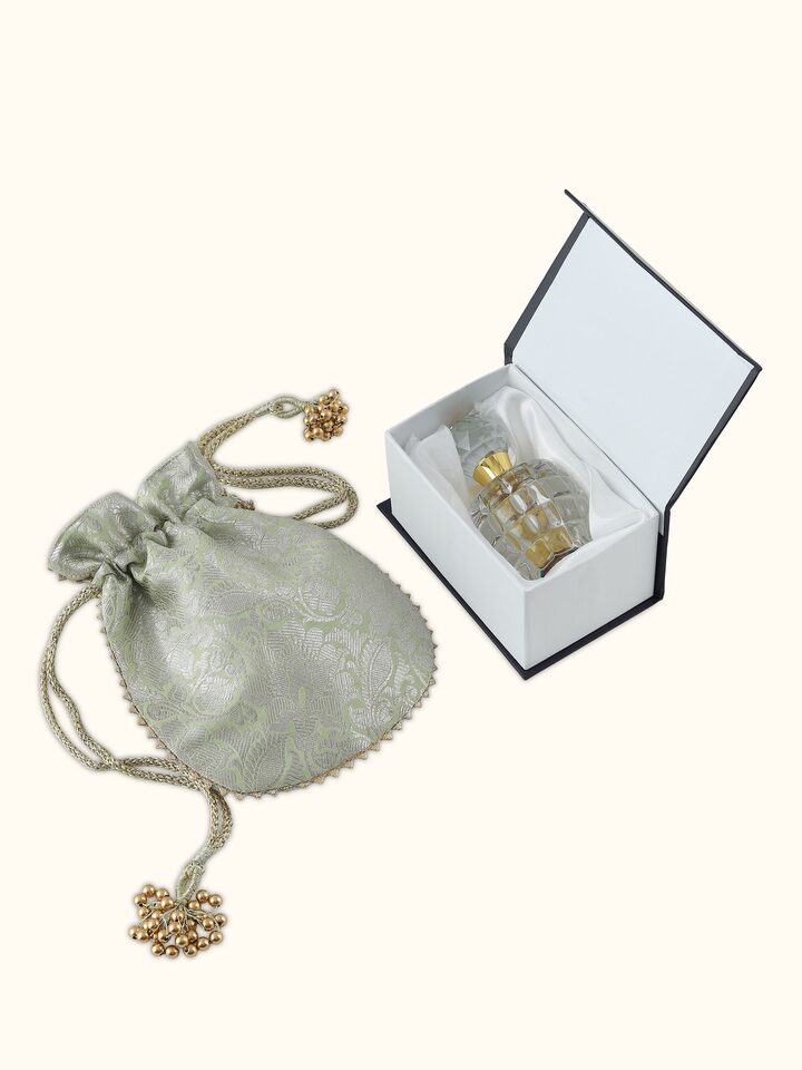 Top view of Attar Mitti bottle showcasing the circular cap and transparent body highlighting the earthy hue