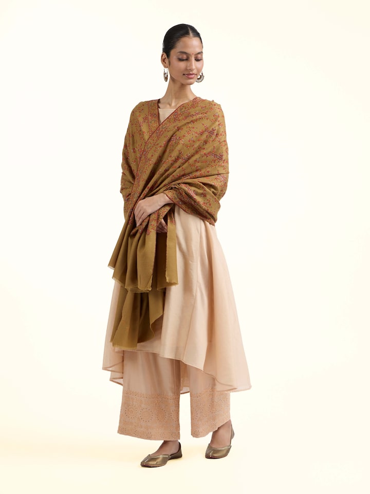 Side view of green jalidar sozni embroidered shawl showcasing fine needlework