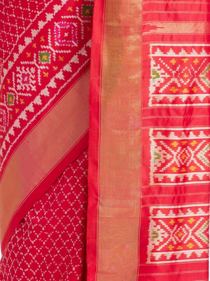 detail view of red weft ikat silk saree pattern