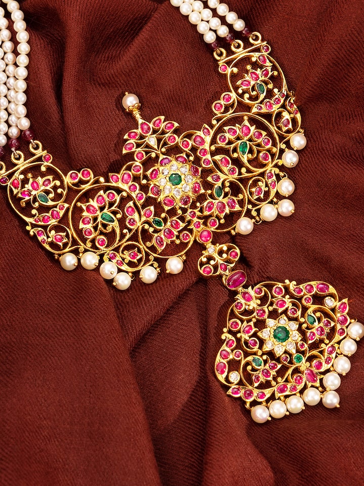 Detailed view of ceramic drop earrings focusing on craftsmanship and colorful details.