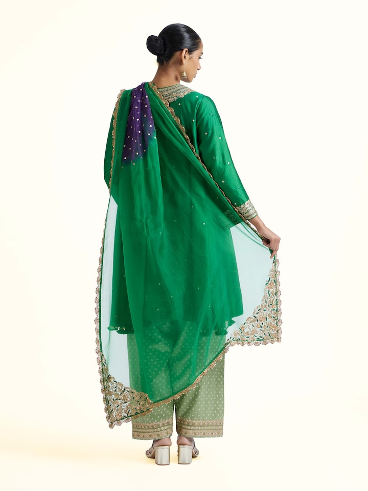 Back view of emerald green silk hand embroidery kurta set displaying refined finish