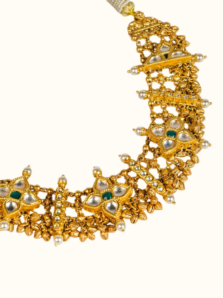 detail view of silver smithing gold plated kundan necklace with kundan work