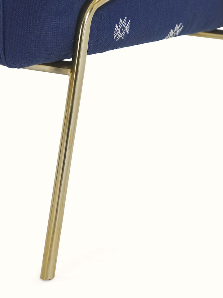 Back view of Upholstered Metal Armchair highlighting the supportive backrest and elegant design.