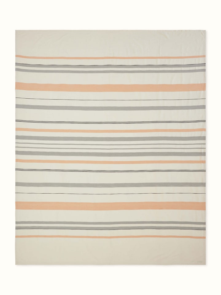Front view of Neerja grey striped handloom bedspread neatly laid out with matching pillow covers
