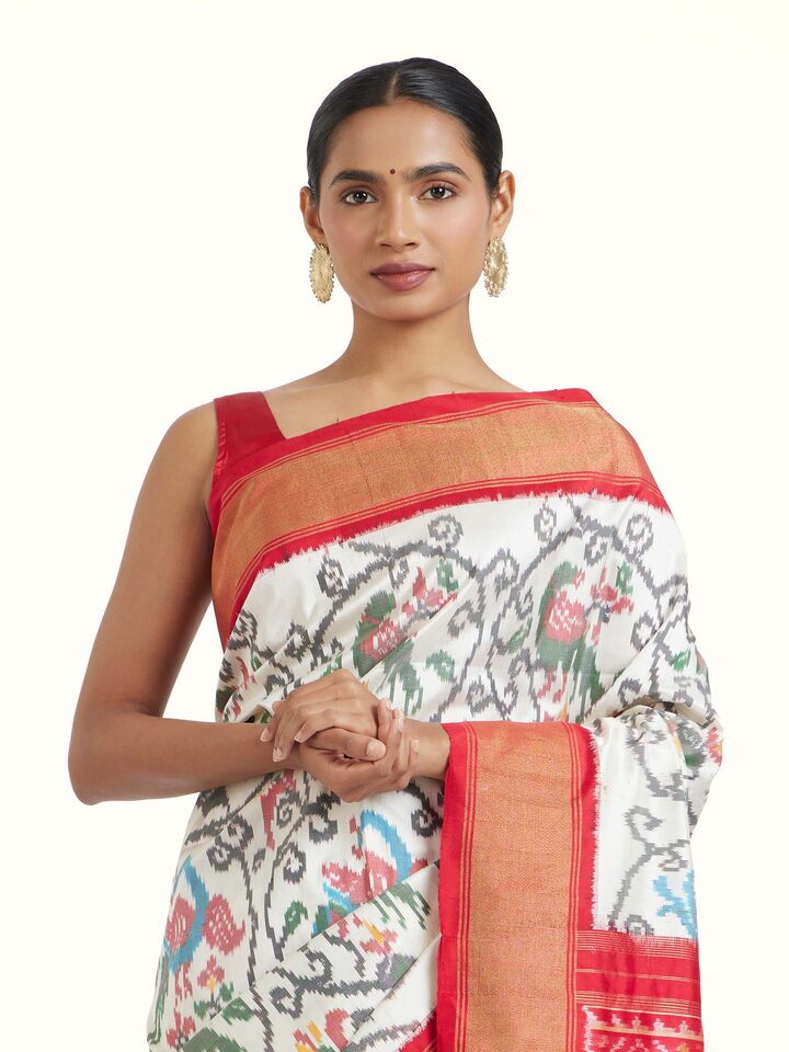 Close-up view of Off-White Pochampally Ikat Silk Saree highlighting the handwoven motif and texture