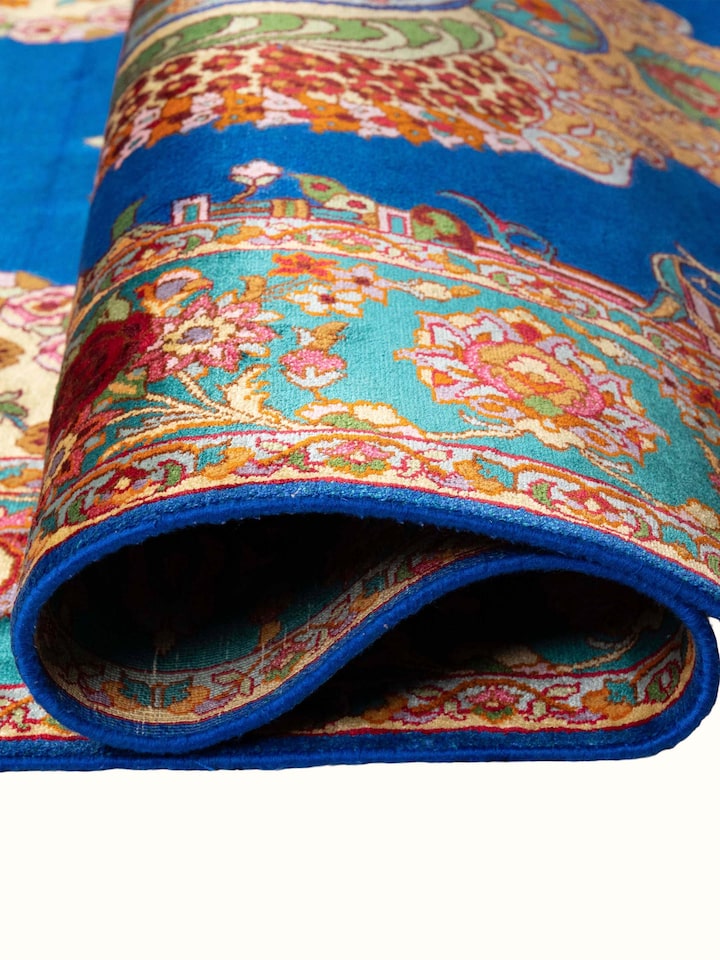 Detail view of Traditional Persian Blue Guldani Kashmir Silk Hand-Knotted Carpet highlighting the intricate pattern and pile texture, from a differ...
