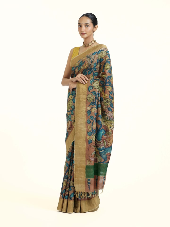 Side view of Beige Kalamkari Tussar Silk Saree highlighting the detailed craftsmanship and elegant silhouette
