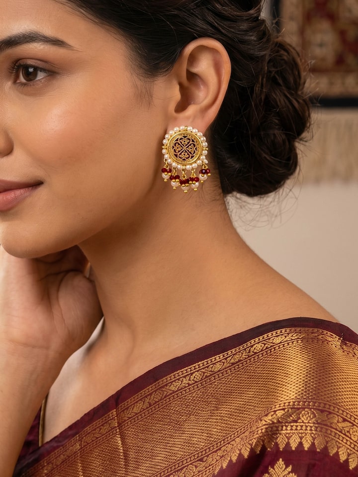 Styled view of Thewa Silver Drop Earrings worn on the ear, showing how it looks styled