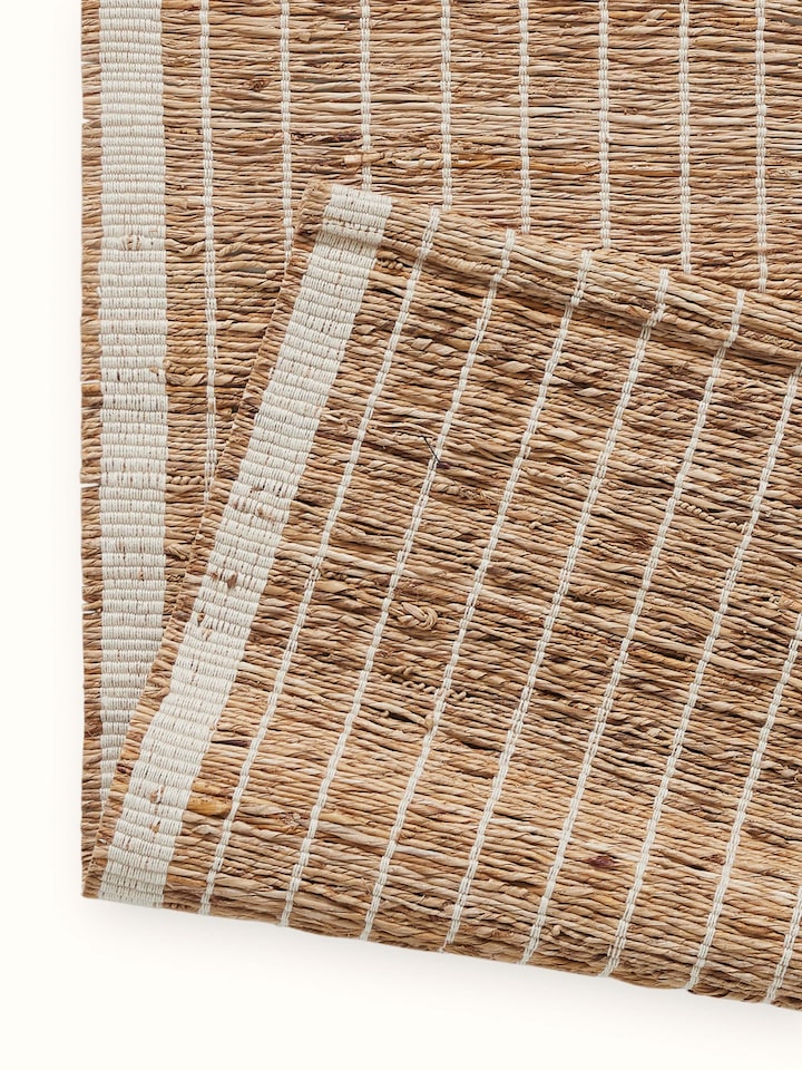 Artistic shot focusing on the soft sheen and durability of the runner’s woven stripes