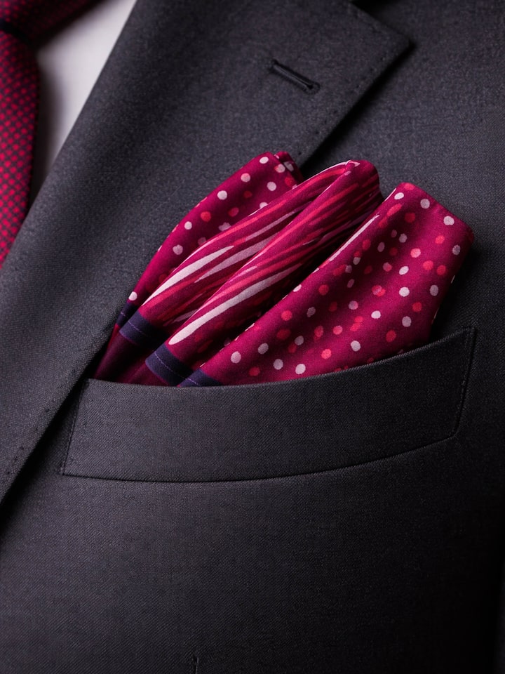 lifestyle view of assorted silk discharge block printed pocket squares set