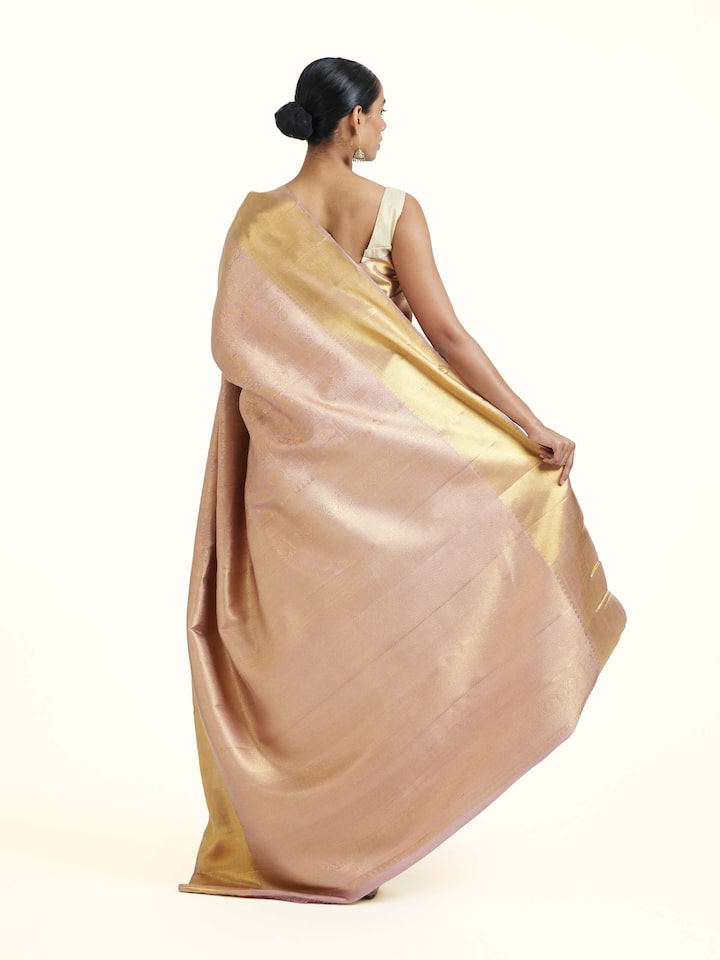 back view of gold kancheepuram silk zari saree