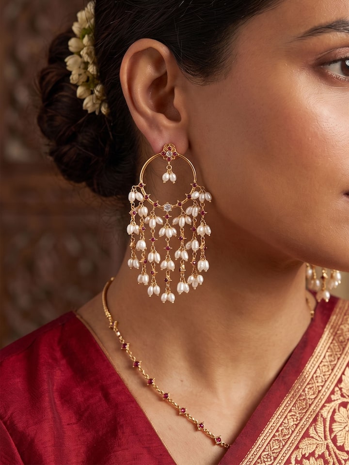 Styled view of Guttapusalu Silver Drop Earrings worn on the ear, showing how it looks styled