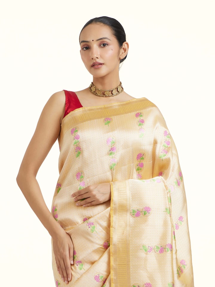 Angled view of Yellow Banarasi Kadhwa Silk Saree revealing the depth of its color and intricate pattern