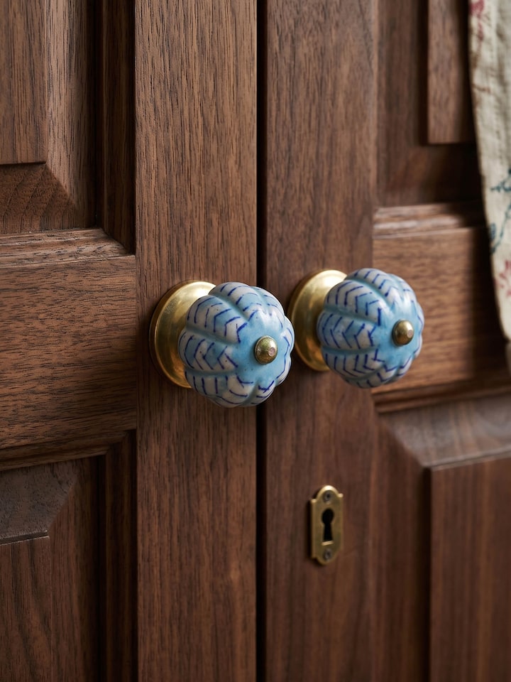 Styled view of Blue Pottery Round Rib Door Knob Set styled in a home setting