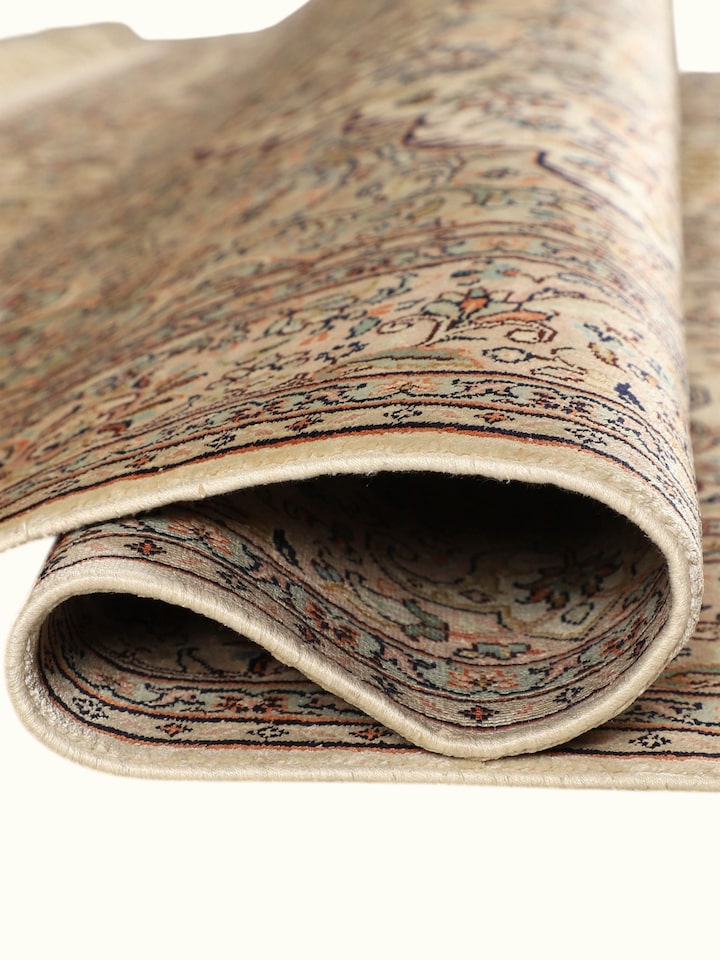 Detailed view of the Traditional Persian Ivory Pink Kashan Kashmir Silk Hand-Knotted Carpet craftsmanship
