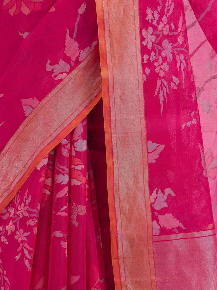 Detail view of pink cotton Awadh Jamdani saree showing cotton texture and craftsmanship