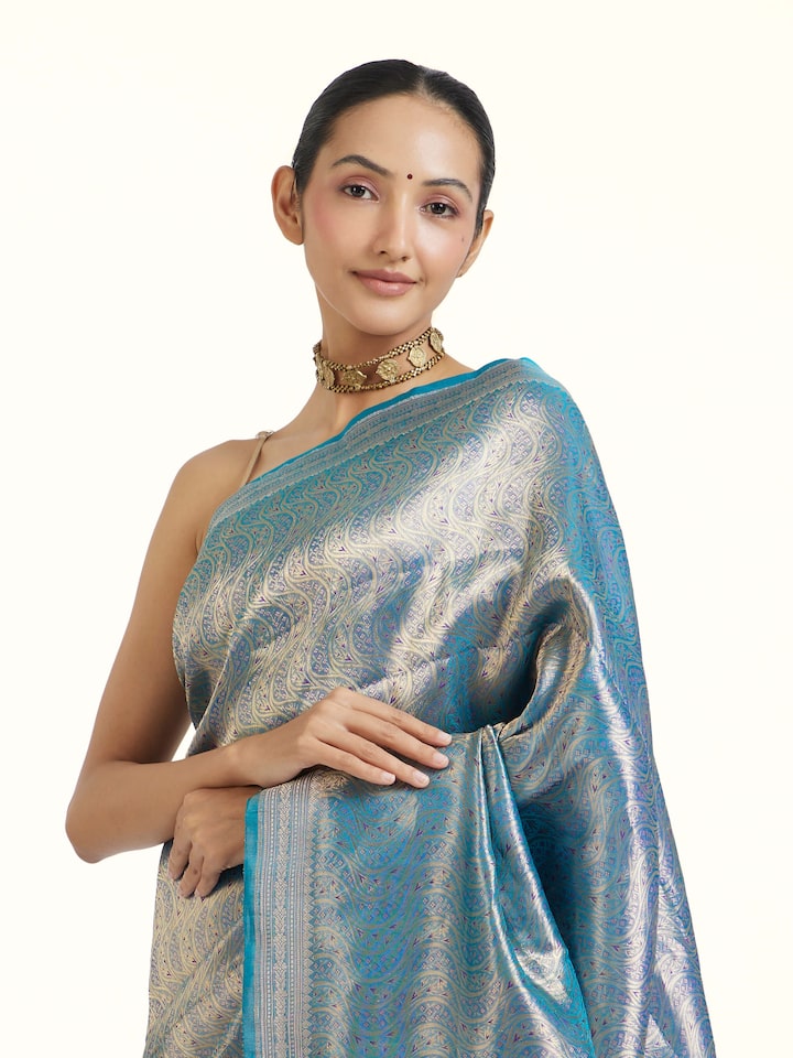 Angled view of Blue Banarasi Tissue Silk Saree revealing the depth of its color and intricate pattern