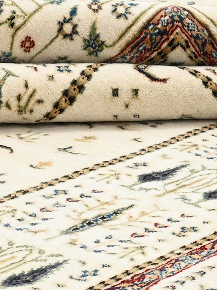Detail view of Traditional Persian Ivory Tree of Life Bhadohi Wool & Bamboo Silk Hand Knotted Rug highlighting the intricate pattern and pile textu...