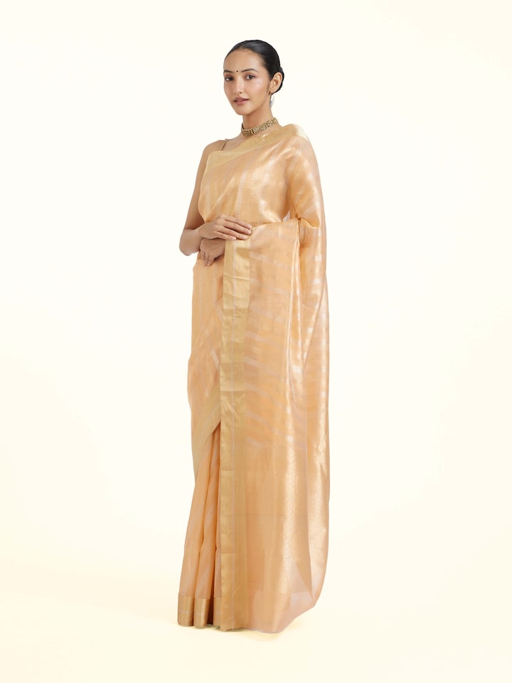 Side view of Peach Chanderi Jal Saree highlighting the detailed craftsmanship and elegant silhouette