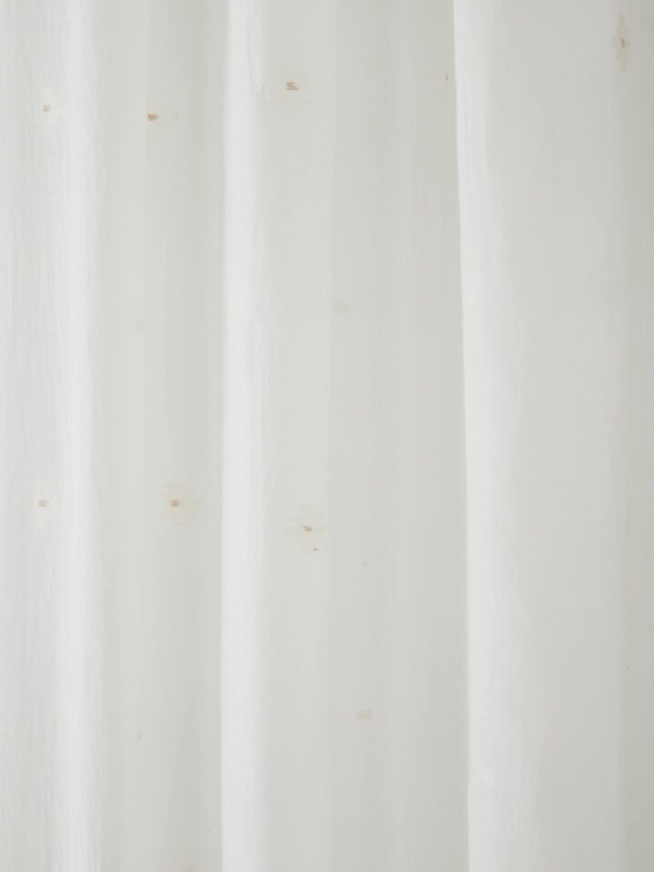 Detail shot of Kalpanama Ivory Buti Curtain, showcasing the handcrafted cotton weave and traditional motifs.