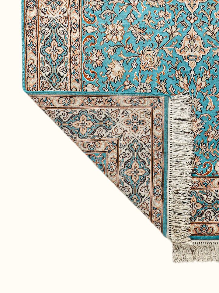 Side-angle view of the Traditional Persian Turquoise Medallion Kashmir Silk Hand-Knotted Carpet
