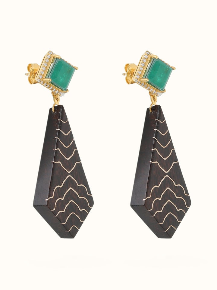 Angled view of Tarkashi silver drop earrings