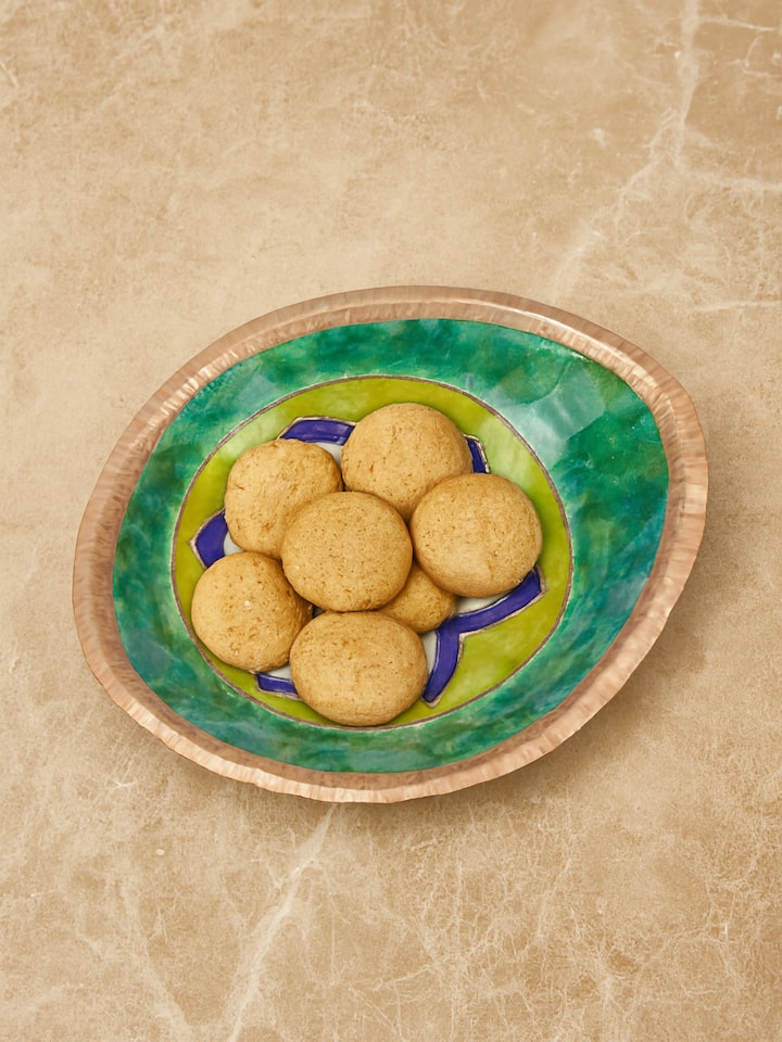 Lifestyle view of copper nut bowl handcrafted metal tableware