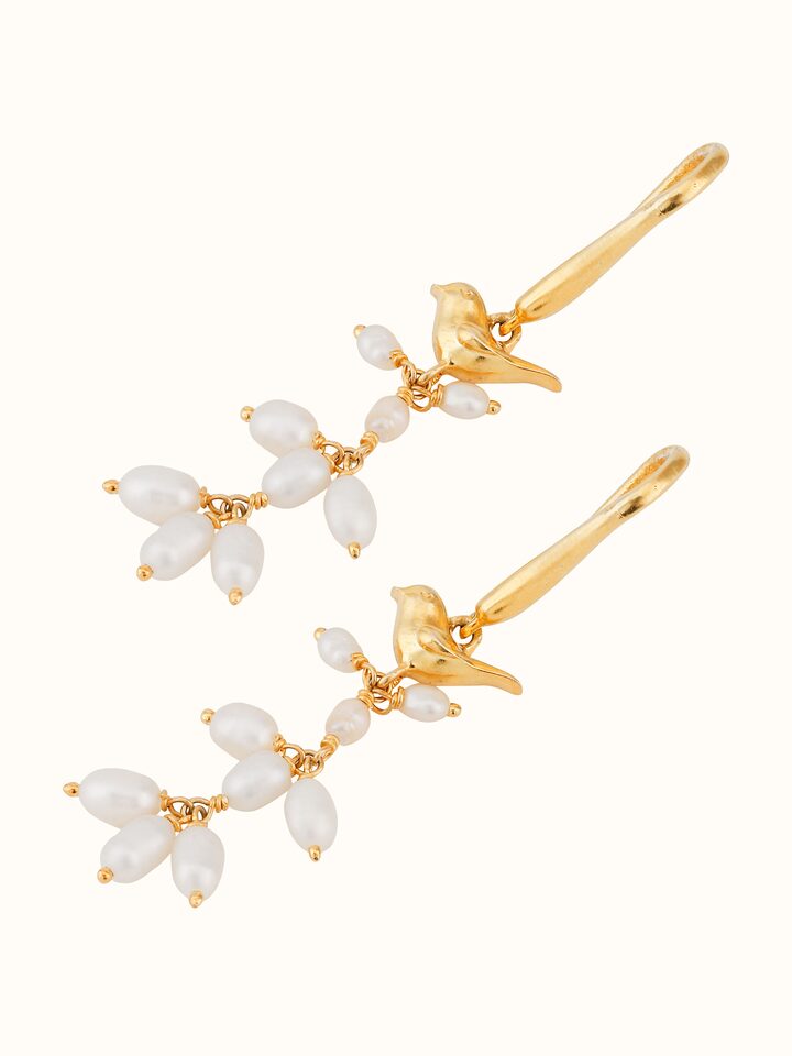 top view of silver smithing drop earrings