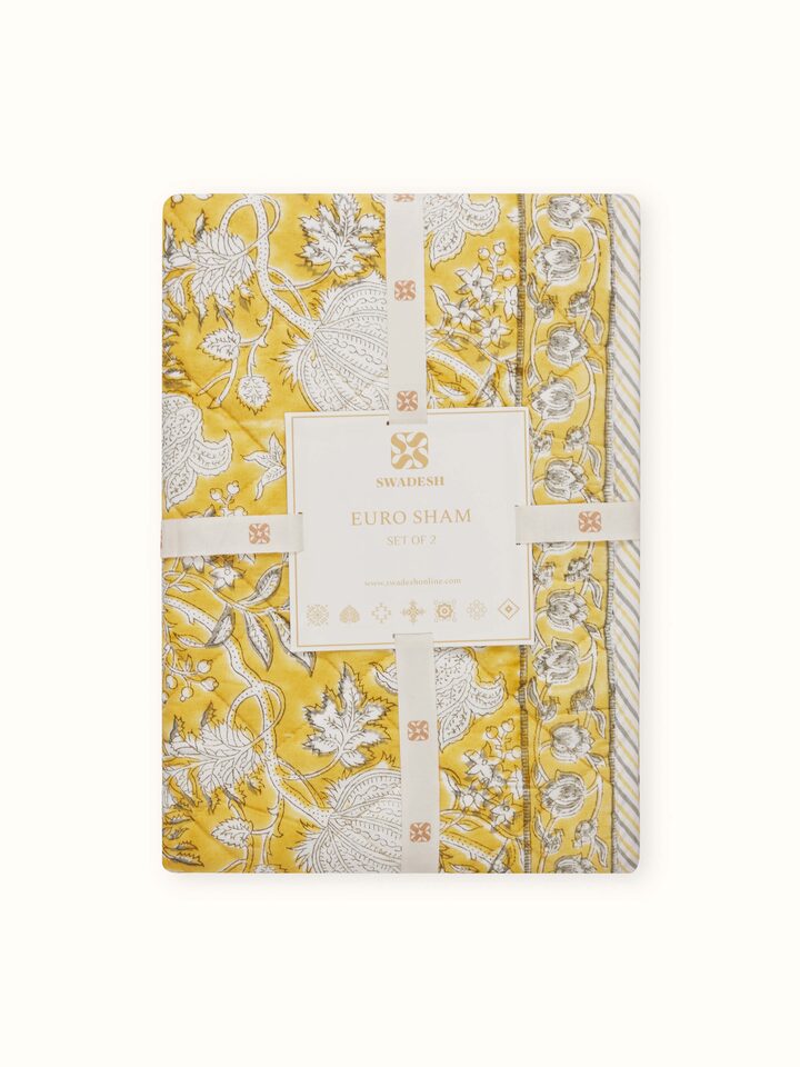 Back view of yellow cotton euro shams with seamless finish and floral hand block print.