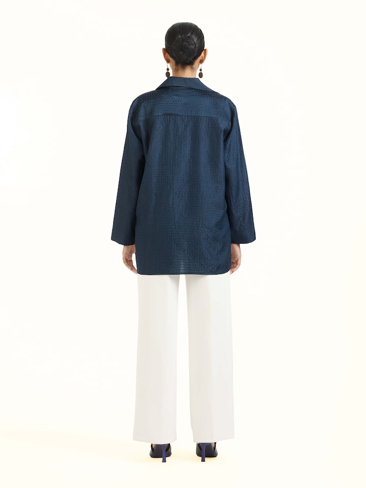 Back view of blue silk kantha shirt displaying overall design
