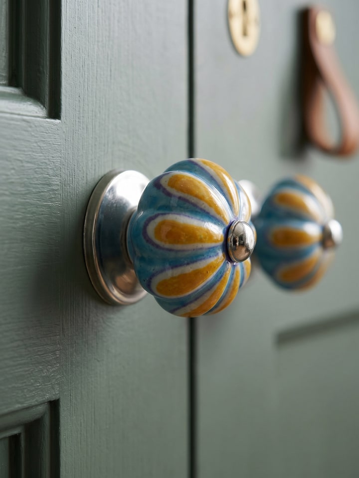 Styled view of Blue Pottery Round Rib Door Knob Set styled in a home setting
