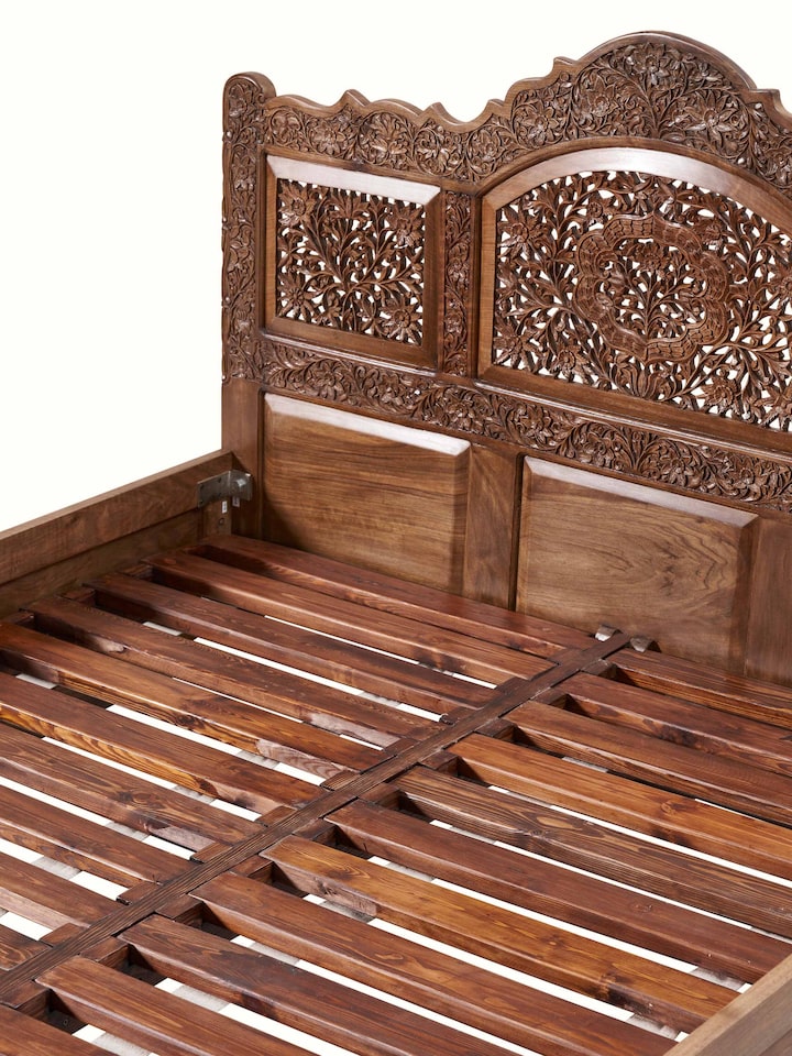 Detail view of Carved Walnut Wood Queen-size Bed highlighting the woodwork and finish detail, from a different angle
